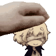 a hand is putting a cartoon character 's head on a table .