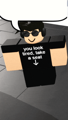 a man wearing headphones and a black shirt that says you look tired take a seat