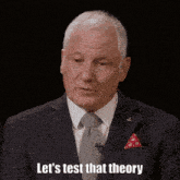 a man in a suit and tie is saying " let 's test that theory "