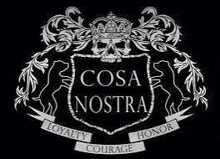 a black and white coat of arms with a skull and a crown on it .