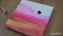 a painting of a sunset is being made in animatica