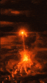 a person is surrounded by flames on a dark background