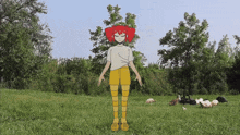 a girl with red hair is standing in a field