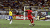 a soccer player wearing a red jersey with the number 10 on it