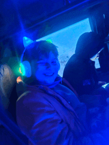 a person wearing headphones with a cat ear on it