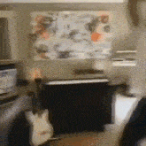 a blurry photo of a living room with a piano and a guitar .