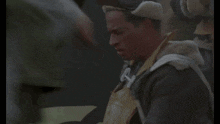 a blurry picture of a person 's arm with the word army on the bottom