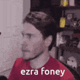 a man in a red shirt with the words ezra foney written on it