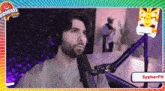 a man with a beard is sitting in front of a microphone with the name sypherpk on the bottom