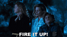 a group of people looking up at the sky with the words fire it up written on the bottom