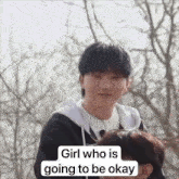a boy is standing next to another boy with the words `` girl who is going to be okay '' written on the bottom .