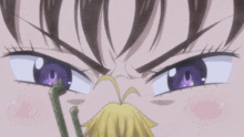 a close up of a person 's eyes with a purple diamond in the middle