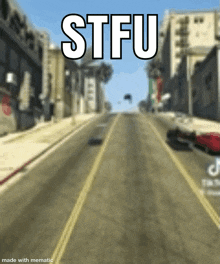 a blurry picture of a city street with the words stfu on the top