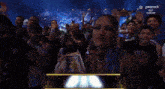 a woman stands in front of a sign that says peacock night diamond