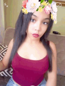 a woman wearing a flower crown on her head