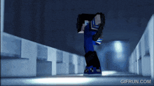 a gif from gifrun.com shows a cartoon character in a dark room