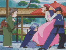 a woman in a pink dress is being held by a man in a blue uniform