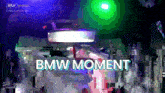 a blurry picture of a car with the words " bmw moment " on it