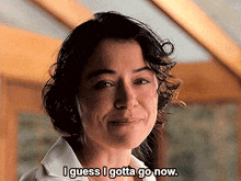 a woman says " i guess i gotta go now " while smiling