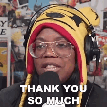 a woman wearing a tiger hat and headphones is saying thank you so much