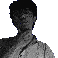 a man wearing glasses and a white shirt has his hand on his chin