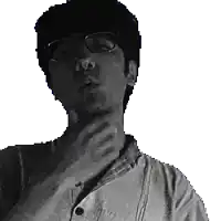 a man wearing glasses and a white shirt has his hand on his chin