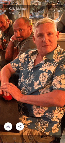 kelly mchugh is the name of the man in the blue floral shirt