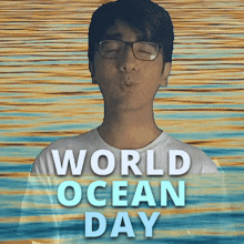 a man wearing glasses is blowing a kiss in front of a sign that says world ocean day