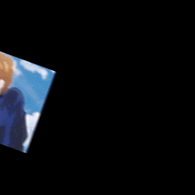 a blurry picture of a person in a blue shirt