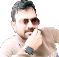 a man wearing sunglasses and a smart watch has a sweater that says a t30 on it