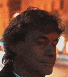 a close up of a man 's face with the eyes closed