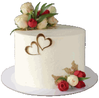 a white cake with two hearts on it and roses on top