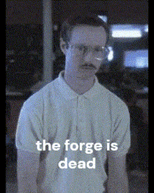 a man with glasses and a mustache is standing in front of a sign that says the forge is dead