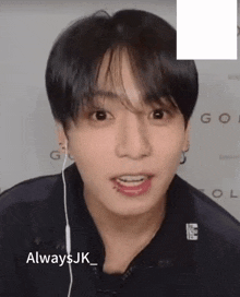 a close up of a person 's face with the words always jk written below it