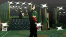 a man with green hair is standing on a stage with his hands in the air