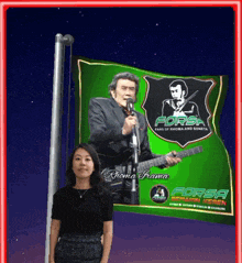 a woman is standing in front of a forsa flag