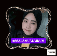 a woman wearing a black hijab and a yellow shirt has the name qinan on the bottom left