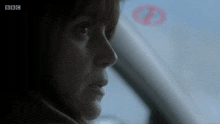 a close up of a woman 's face with bbc written on the bottom right