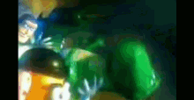 a blurred image of a toy story character and a green item