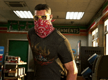 a man wearing sunglasses and a bandana in a store with a sign that says shments