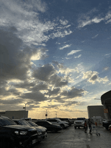 a lot of cars are parked in a parking lot