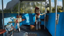 a little red riding hood is standing in a blue bus