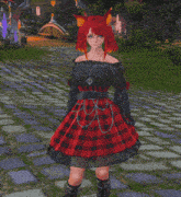 a girl with red hair and a red and black plaid skirt