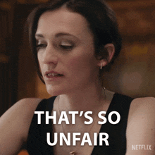 a woman says that 's so unfair with a netflix logo behind her