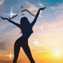 a silhouette of a woman with her arms outstretched and chains hanging from her head .
