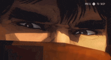 a close up of a man 's face with a press to skip button below it