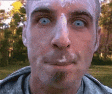 a close up of a man 's face with a gif from gifbin.com in the corner