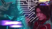 a man is standing in front of a sign that says ' kamen rider '