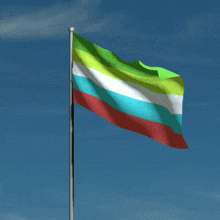a colorful flag is waving in the wind
