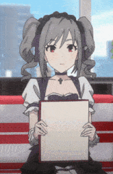 a girl with a cross on her neck holds a piece of paper